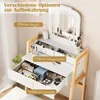 A white vanity table with wooden legs, featuring a mirror and several drawers and shelves filled with makeup and accessories. The image highlights storage options. Produktbild-Vorschau