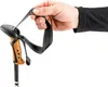 A hand holding the handle of a trekking pole. Náhled obrázku produktu