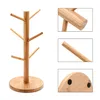 A wooden mug tree stand with multiple hooks for hanging mugs. Produktbild-Vorschau