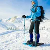 A person snowshoeing in a snowy mountain landscape. Produktbild-Vorschau