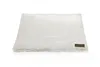 A cream-colored, fluffy dog mat with a brown logo tag on the bottom right corner, isolated on a white background. Produktbild-Vorschau