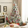 A decorated artificial Christmas tree in a living room setting, with gifts and decorations around it. Anteprima dell’immagine prodotto