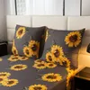 A close-up view of a bedding set with a sunflower pattern. Anteprima dell’immagine prodotto