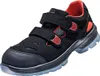 A black safety shoe with red accents and a blue sole is shown against a white background. Produktbild-Vorschau