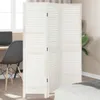 A white room divider is shown in a room with a desk and chair on the left and a bed on the right. Podgląd zdjęcia produktu