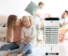 A family is enjoying their living room with a portable air cooler. Produktbild-Vorschau