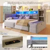 A modern bed with integrated storage, lighting, and charging features, presented in a bedroom setting with close-up details. Produktbild-Vorschau