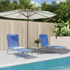Two blue lounge chairs are set up on a patio next to a swimming pool, under a large umbrella. Produktbild-Vorschau
