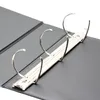 A close-up view of the inside of a black binder, showing the metal rings for holding pages. Náhľad obrázku produktu