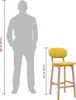 A silhouette of a person stands next to a bar stool, with measurements indicating their relative heights. Produktbild-Vorschau