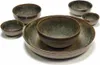 A set of ceramic bowls and a plate with a speckled green and brown glaze. Voir les images du produit