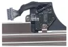 A close-up view of a component with a cable and circuit board, mounted on metal rails. Náhled obrázku produktu