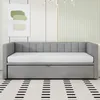 A grey daybed with a white mattress is shown in a room with a painting on the wall and a striped rug on the floor. Anteprima dell’immagine prodotto
