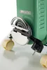 Close-up of the cord wrap and plug of a green oil-filled radiator. Voir les images du produit
