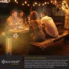People enjoying a meal outdoors at night, illuminated by string lights and a patio heater. Produktbild-Vorschau