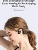 A woman wearing black bone conduction headphones. Podgląd zdjęcia produktu