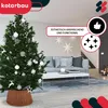 A decorated Christmas tree with a woven tree skirt in a living room setting. Náhľad obrázku produktu