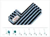 A close-up of a blue and black striped mop head, folded in half, with a white label attached. Produktbild-Vorschau