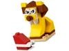 A LEGO lion figure and a red and white object on a white background. Produktbild-Vorschau