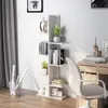 A white, multi-tiered bookshelf filled with books and decorative items, placed against a white wall next to a grey curtain and a desk with a chair. Podgląd zdjęcia produktu