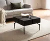 A living room scene with a sofa, coffee table, and rug. Anteprima dell’immagine prodotto