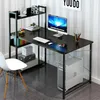 A black computer desk with shelves, a computer, keyboard, mouse, and other office supplies. Podgląd zdjęcia produktu