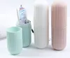 Three toothbrush holders and a tube of toothpaste are displayed on a white background. Produktbild-Vorschau