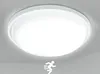 A white, round LED ceiling light with a motion sensor icon is shown against a light gray background. Náhľad obrázku produktu