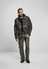 A man is standing and posing in a studio setting, wearing a camouflage jacket and olive-colored cargo pants. Produktbild-Vorschau