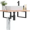 A bathroom sink with a faucet and accessories on a shelf. Náhled obrázku produktu