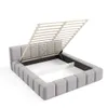 A grey upholstered bed frame with the mattress support slats lifted, revealing the storage compartment underneath. Produktbild-Vorschau