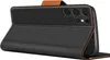 A black flip case for a smartphone is shown from a side angle, with the front cover open. Produktbild-Vorschau
