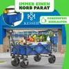 A blue foldable wagon filled with groceries, parked in front of a store. Produktbild-Vorschau