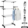 A three-tiered foldable drying rack with clothes hanging on it, shown against a white background. Anteprima dell’immagine prodotto