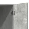 A close-up view of a cabinet hinge on a concrete-effect surface. Produktbild-Vorschau
