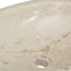 A close-up view of a marble sink with a drain hole. Produktbild-Vorschau