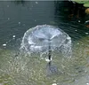 A solar-powered fountain pump operating in a pond. Produktbild-Vorschau