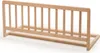 A light brown wooden bed guard rail is shown against a white background. Voir les images du produit