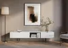 A modern living room scene featuring a white TV stand with artwork and a floor lamp. Produktbild-Vorschau