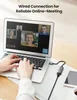A person's hands are typing on a laptop keyboard, which is connected to a Ugreen network adapter. A smartphone and a coffee cup are also visible on the desk. Voir les images du produit