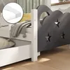 A close-up view of a child's bed frame with a drawer and a decorative headboard. Anteprima dell’immagine prodotto