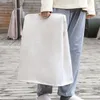 A person is holding a large, white laundry basket with wooden handles. Náhľad obrázku produktu