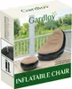 The image shows the packaging of an inflatable chair and footrest set, displayed on a wooden deck with a railing and trees in the background. Produktbild-Vorschau