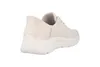A side view of a beige Skechers sneaker against a white background. Voir les images du produit