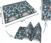 A collage showing a foldable educational foam mat with a castle and road design, including its unfolded and folded states, and its dimensions. Podgląd zdjęcia produktu