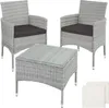 A set of two rattan chairs and a coffee table with a glass top, presented on a white background.