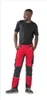 A man wearing work pants and a t-shirt, standing against a white background. Produktbild-Vorschau
