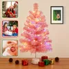 A collage of images showing a pink Christmas tree and related holiday scenes. Anteprima dell’immagine prodotto