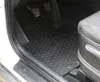 Interior view of a car showing the driver's side floor mats. Produktbild-Vorschau