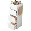 A white cosmetic storage rack with multiple drawers and compartments, holding various bottles and containers on top. A towel is hanging from a side rack. Produktbild-Vorschau